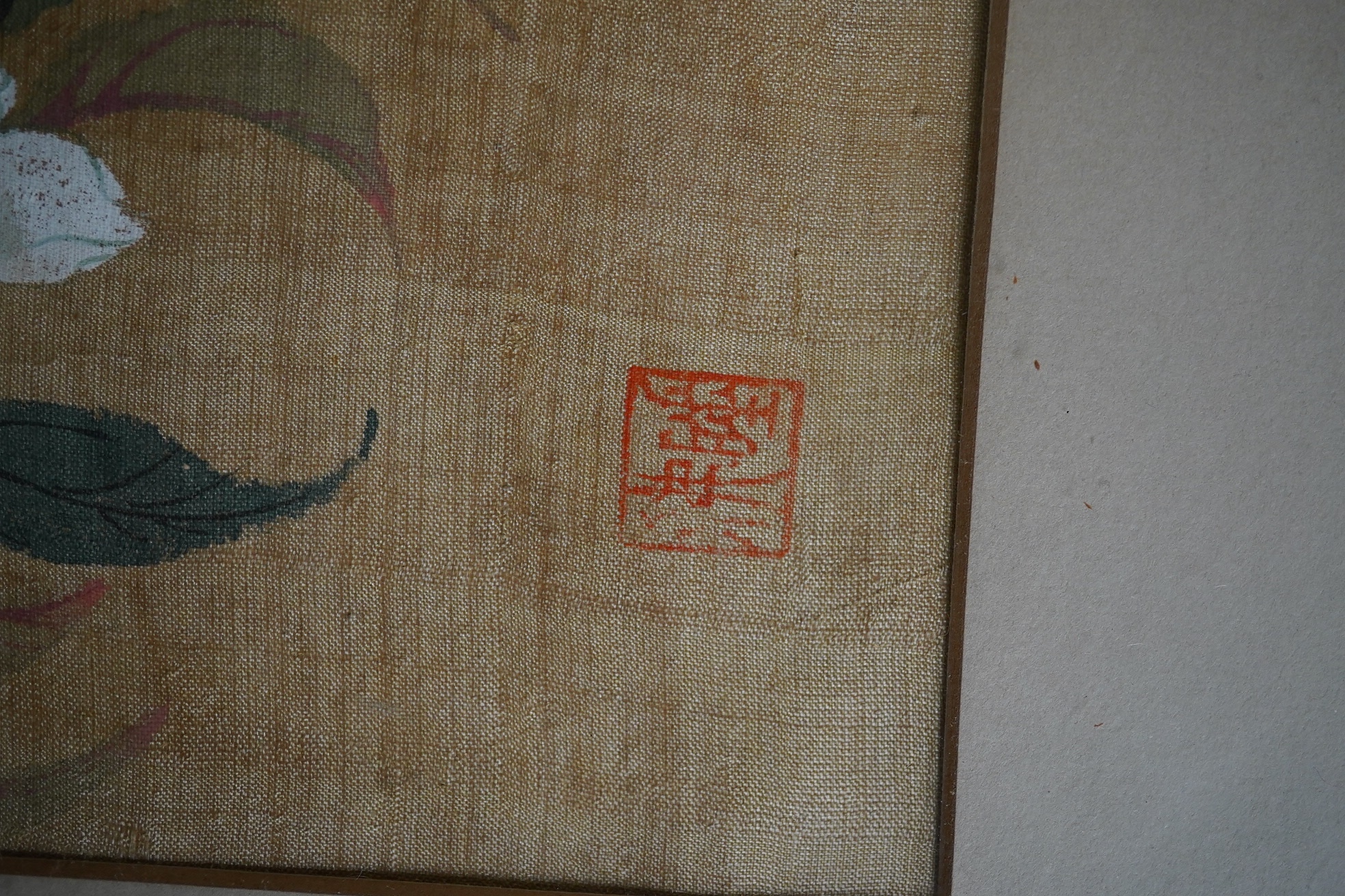 An early 20th century, Chinese School, watercolour on silk, Study of flowers, signed with red seal mark, 26.5 x 19.5cm. Condition - fair, discolouration throughout